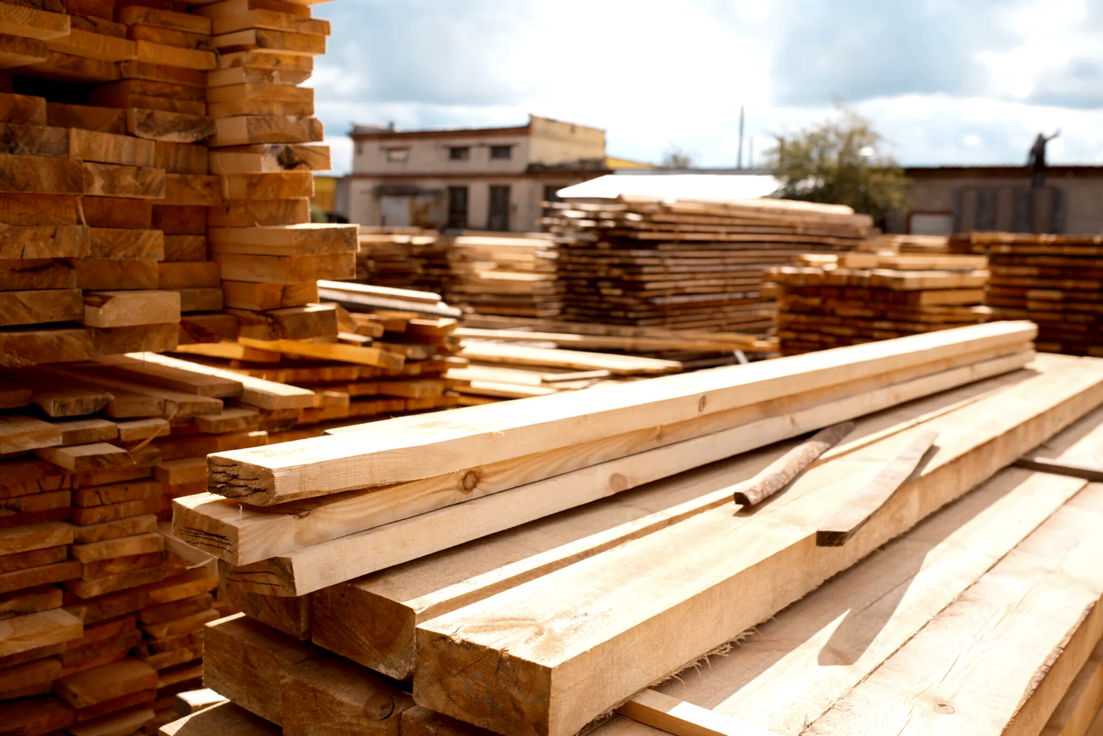 Boards on timber mill warehouse outdoor, nobody, lumber industry, carpentry. Wood processing on factory, forest sawing in lumberyard, sawmill