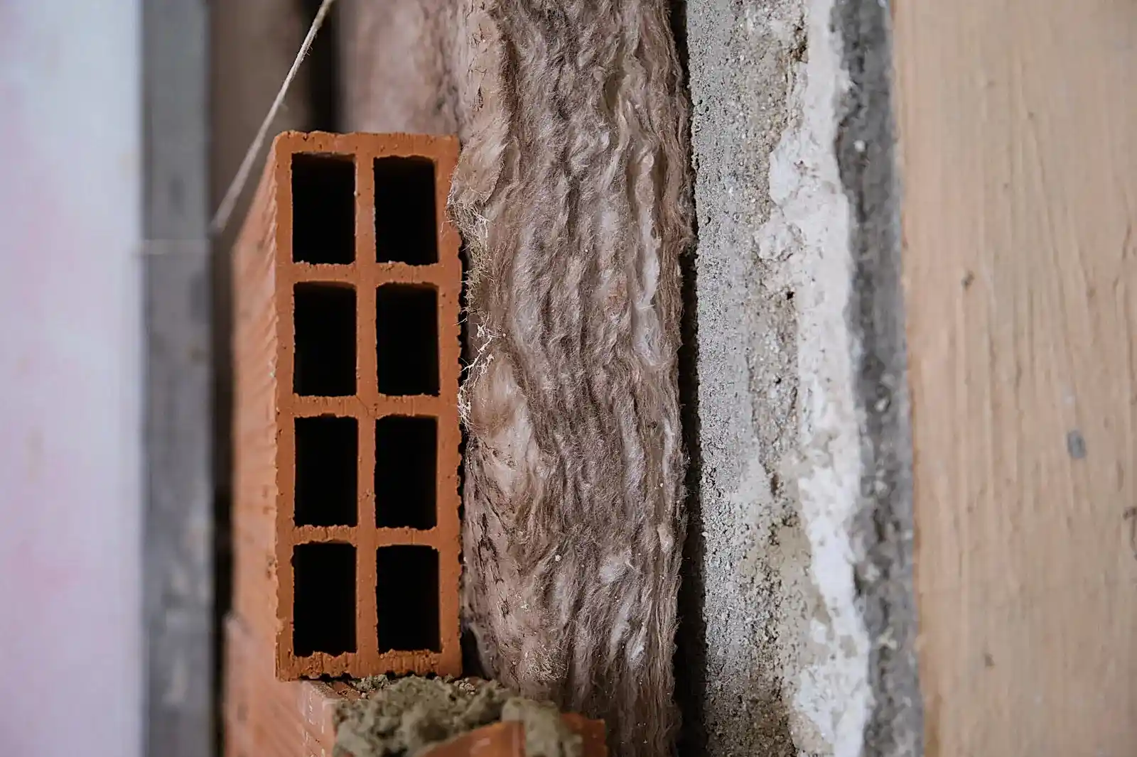 Brown Insulation rock wool blanket placing between the wall and the brick layer. Acoustic and thermal insulation.